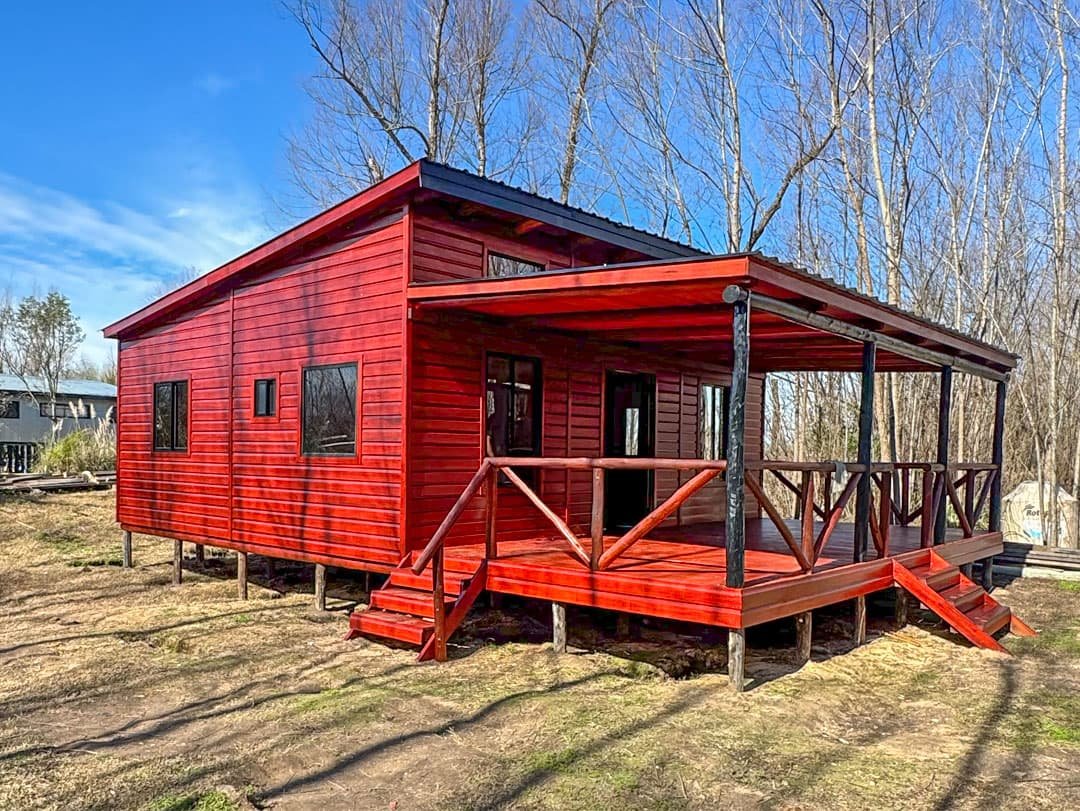 Fachada de cabaña de madera para la guía de construccion